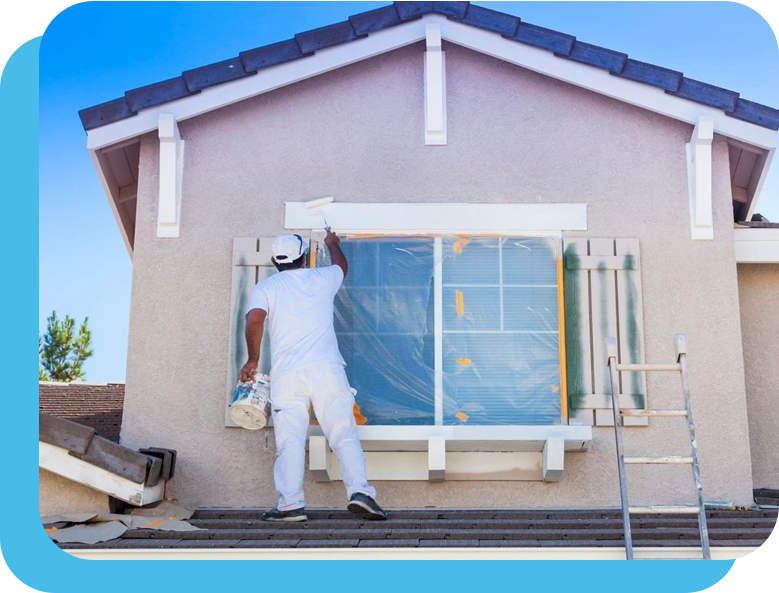 A man painting the outside of a house.